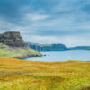 Dramatic sea cliffs in Scotland under a cloudy sky