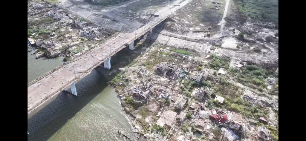 Aerial shot of a destroyed Antonivskyi Bridge